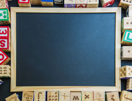 Blank blackboard on wooden block