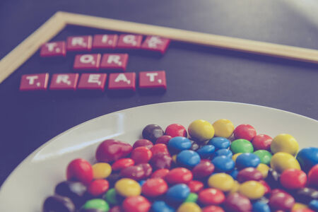 Trick or Treat word on blackboard with colorful chocolate candy7