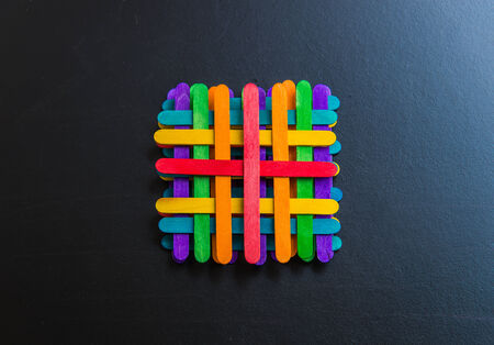 Colorful stripes wooden lay by sequence layer on black boardの写真素材