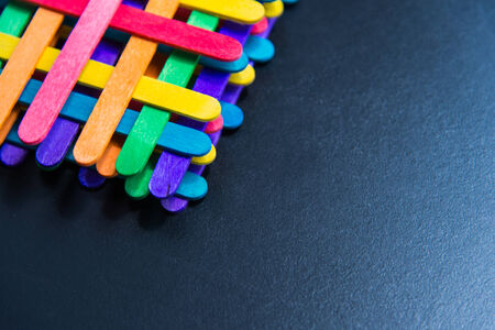 Colorful stripes wooden lay by sequence layer on black boardの写真素材