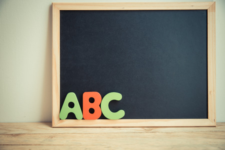 ABC wooden word and black board on the wallの写真素材