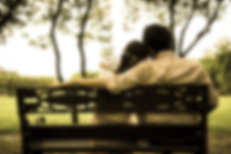 Backside of lover couples in the garden in Blur styleの写真素材