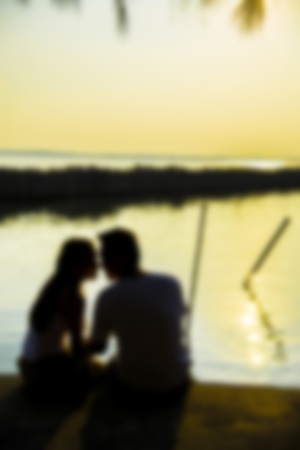 Lovely Couple sit and look together with romance scene in Blur styleの写真素材