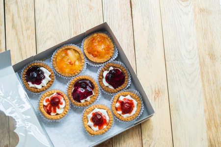 Variety fruit tart in paper boxの写真素材