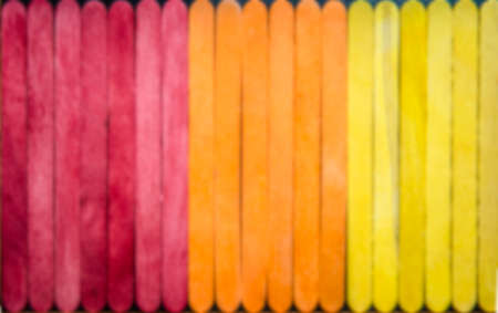 Colorful wooden stripe in three color red orange and yellow in Blur styleの写真素材