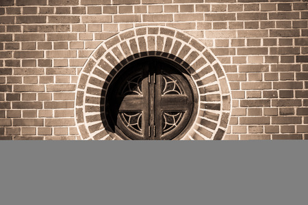 Circle window on the brick wall in monochrome styleの写真素材