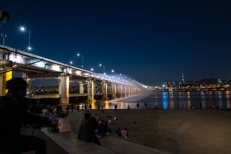 Rainbow bridge with photographer in South Koreaの写真素材