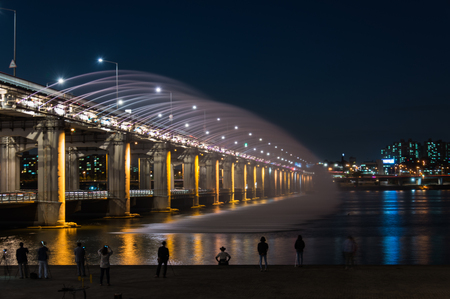 Rainbow bridge with photographer in South Koreaの写真素材