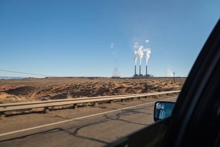 View of Coal power plant through Window car