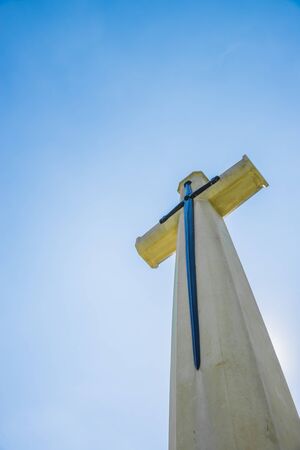 Christian cross with blue clear skyの写真素材