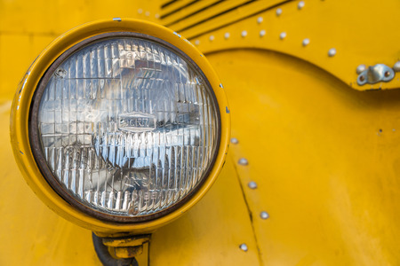 Front lamp of yellow school busの写真素材