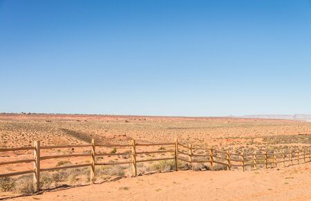 Old wooden fence in countryside of desertの写真素材