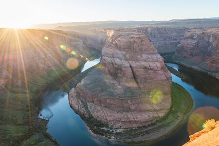 Horse shoe bend in Arizona with sun burst with Lens flareの写真素材