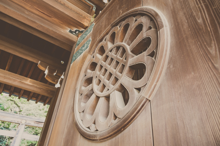Old wooden door Decorate by caving Japanese style in Japanese templeの写真素材