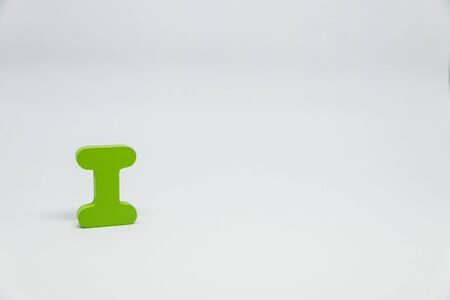 Green Wooden alphabet I with white backgroundの写真素材