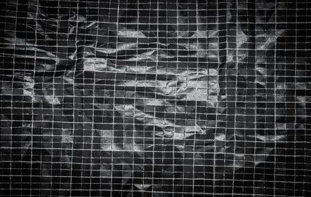 Background of crumped and folded black paperの写真素材