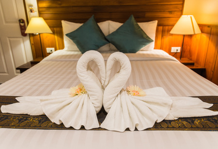 White swan from towel in the bedroom with selective focusの写真素材