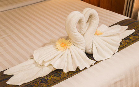 White swan from towel in the bedroom with selective focusの写真素材