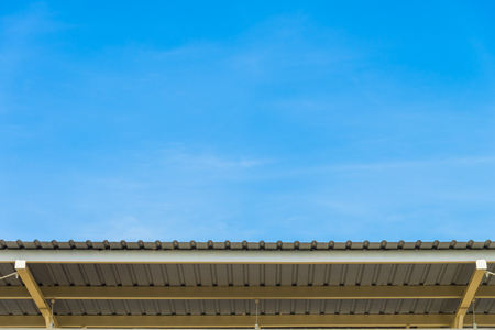 The blue sky with Metal sheet roofの写真素材