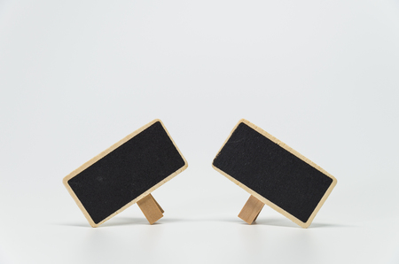 Two small black board with white background and selective focusの写真素材