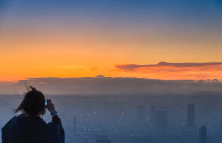 Blur Tourist take photo Fuji mountain in the evening sceneの写真素材
