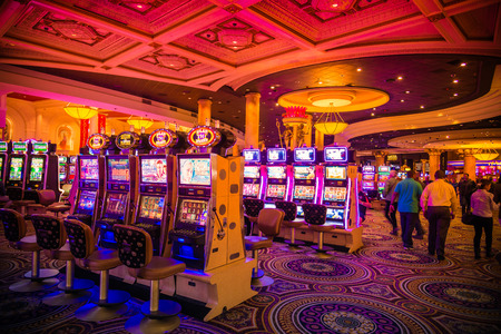Colorful Casino machines in Entertainment area at nightのeditorial素材