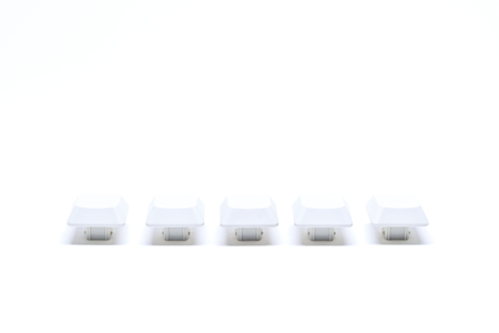 Five White keyboard button in row sequence isolated on white backgroundの写真素材