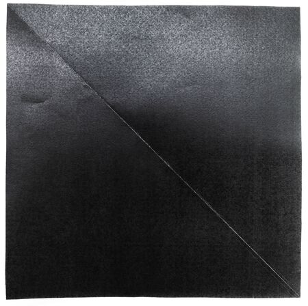 Folded black paper in 2 parts with diagonal style on white backgroundの写真素材
