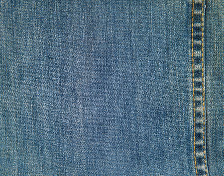 Close up denim jeans texture with copy space seam row for design conceptの写真素材