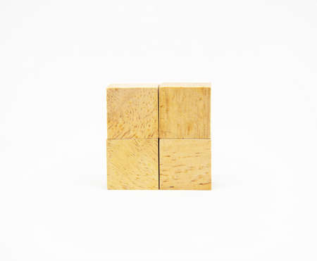 Two layer of wooden square block with O and X character symbol isolated on white background for design conceptの写真素材