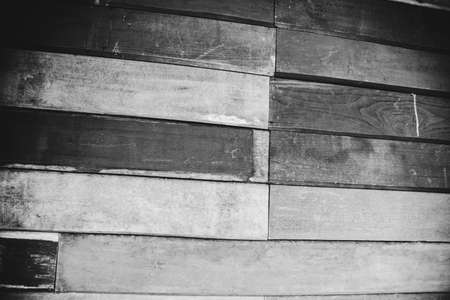 Wall patched old wooden board in black and white concept designの写真素材