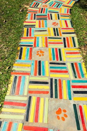 Art of colorful square bricks on footpath walkway outdoor in the garden with exterior design concept ideaの写真素材