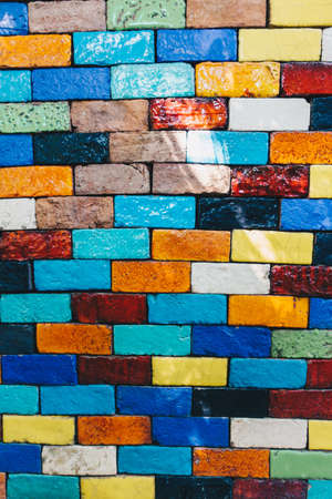 Abstract colorful square bricks wall decorate outdoor arrange in horizontal style with creative background concept ideaの写真素材