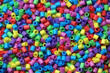 Group of plastic beads of many colorsの写真素材