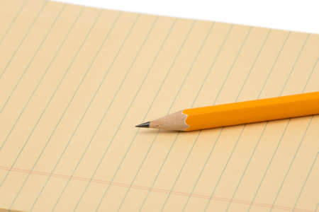 notebook and pencil isolated on white backgroundの写真素材