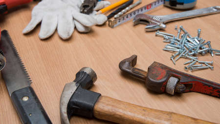 Construction Tools On Wooden Deskの写真素材