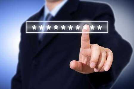 Businessman hand touching password login device screen, cyber security concept.の写真素材