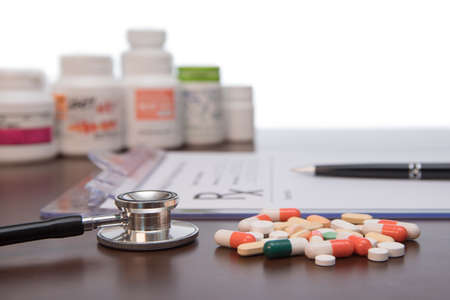 Male doctor hands writing rx prescription.の写真素材