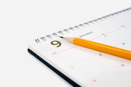 September calendar and pencil on white background.の写真素材