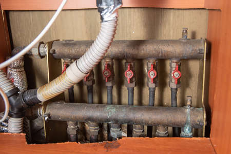 Old sinks and boiler piping that need repair.の写真素材