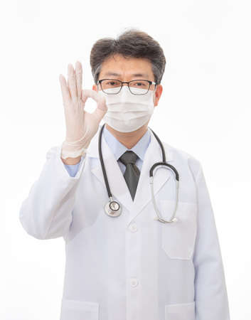an Asian doctor wearing a mask. isolated on white background.の写真素材