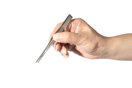 Close up of mans hand holding an tweezersの写真素材