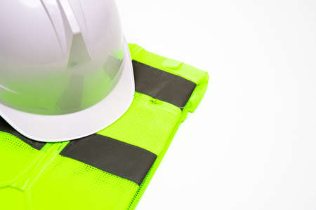 On a white background, there is a safety hat and workwear. With copy space.の写真素材