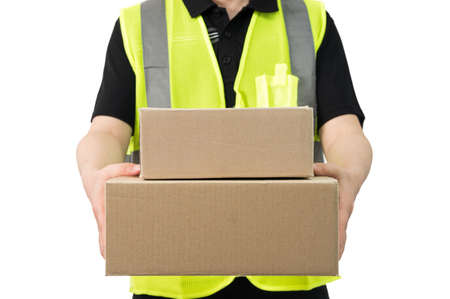 delivery man holding a big parcel isolated on white background.の写真素材