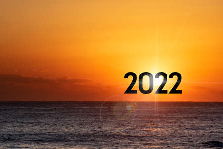 New Year 2022. Beautiful sunrise over the ocean.の写真素材