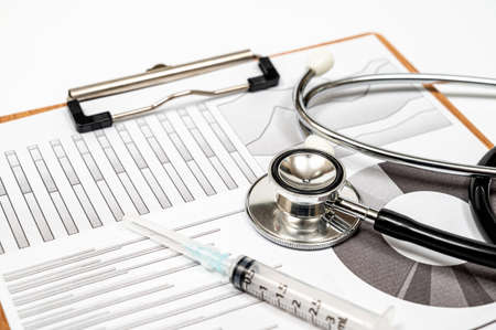 Medical concept background with several types of graphs and a stethoscope.の写真素材