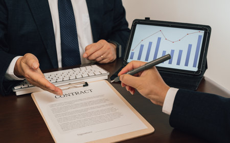 a businessman who writes contracts in the officeの写真素材