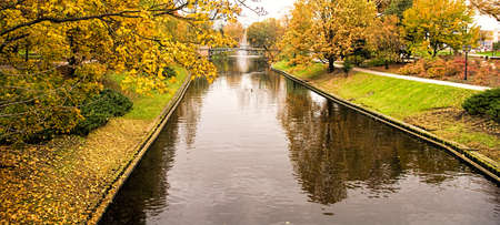 Fall colors over riverの写真素材