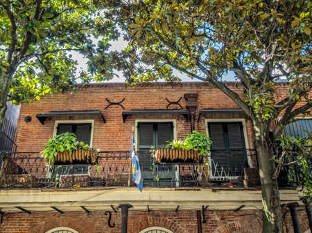 New Orleans, LA, USA -  Sep. 12, 2016  -  Balcony with Plants and Flag in the French Quarter of New Orleansのeditorial素材