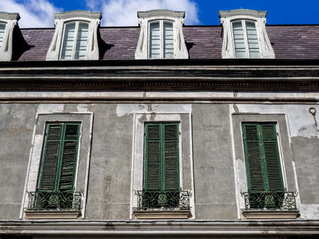 New Orleans LA USA -  Sep. 13, 2016  -  This is a a old building with Green Shutters in the French Quarter of New Orleans LA.  There are many interesting old buildings that are 150+ years old in this location.のeditorial素材